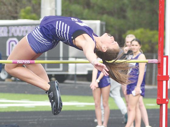 Gilmer senior Kenzie Sewell (above) placed second in the high jump last Tuesday, and sophomore Douglas Callihan (below) finished in the same position  in the shot put.