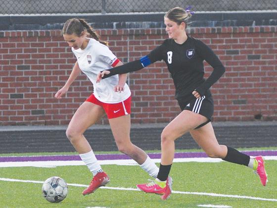 Gilmer senior Sophia Lykins (8) tracks down a ball in midfield and her perfect pass versus Calhoun to teammate Yenifer Lopez preceded the game-winning penalty kick.