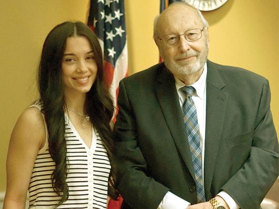 Board of Commissioners Chair Charlie Paris and Ysa Engel, 19, at the proclamation signing recognizing “Rare Disease Day” as Feb. 28.