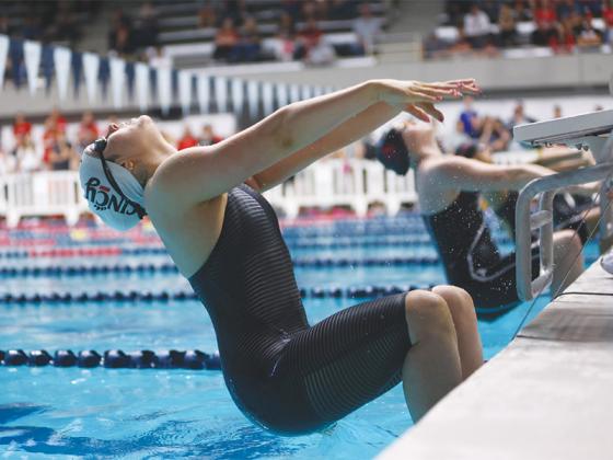 Ellijay’s Payton Woodring starts the backstroke and set the University of Cincinnati’s record in the 200 yards at the Big 12’s Swim and Dive Conference Championships.