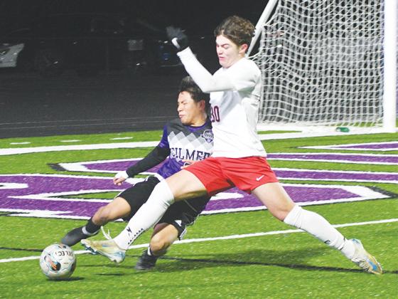 Gilmer defender Angel Reynoso makes a sliding tackle to clear the ball versus Heritage last Thursday.