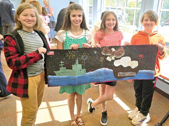 5th graders Leo Handley, Carolina Davis, Faith Dotson and Fox Handley with their banner honoring the 250th anniversary of the U.S. Navy and Marine Corps. They placed 2nd in the southeast United States region. (Courtesy of Misti Foster)