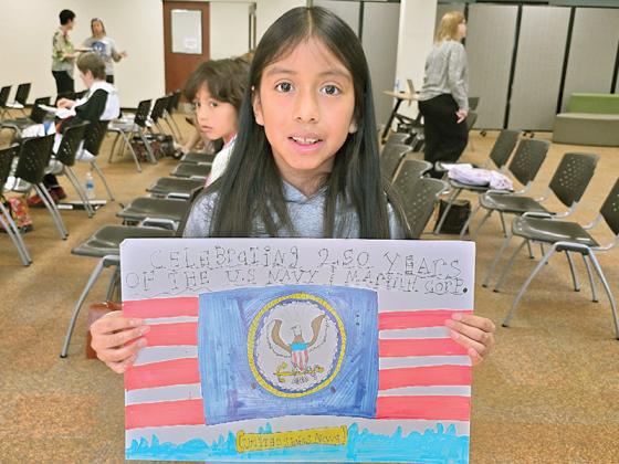 5th grader Isabel Bautista with her district winning poster. (Courtesy of Misti Foster)