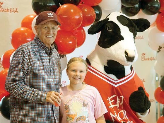 East Ellijay Mayor Don Callihan pictured with his granddaughter, 9-year-old Sarah Jane Callihan, at Chick-fil-A’s soft opening. He said Sarah Jane wants to own one when she’s older. 