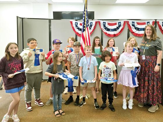 Mountain View Elementary students, alongside art teacher Misti Foster, accepted national awards from the Daughters of the American Revolution on Thursday, April 17, for their artwork. (Courtesy of Misti Foster)