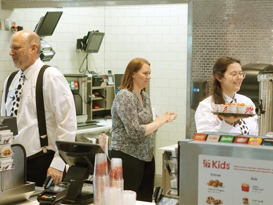 Chick-fil-A’s staff working to serve friends and family at its soft opening.