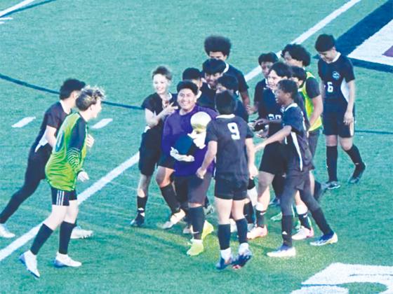 Clear Creek soccer players celebrate their Mountain League championship after defeating Union County, 2-1.