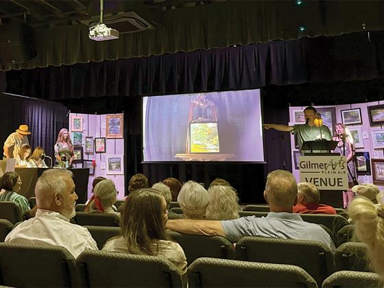 The weekend of painting ended with an auction at the playhouse Sunday afternoon, where bidding wars broke out over buyers’ favorite framed canvases. Artists received 65 percent of commission from their work sold, and 35 percent is kept by the nonprofit, to help fund their new gallery being built next to the playhouse in downtown Ellijay. So far, 43 out of 94 paintings completed during Plein Air have been sold, according to volunteer coordinator Randy Simpson. (Lauren Sabia/Reporter)