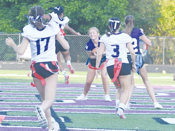 Gilmer High held its annual seniors versus juniors flag football game May 14. The seniors added two scores in the second half, which included a touchdown pass from quarterback Caylee Elrod to receiver Julibelle Queen (14) for a 19-6 victory.