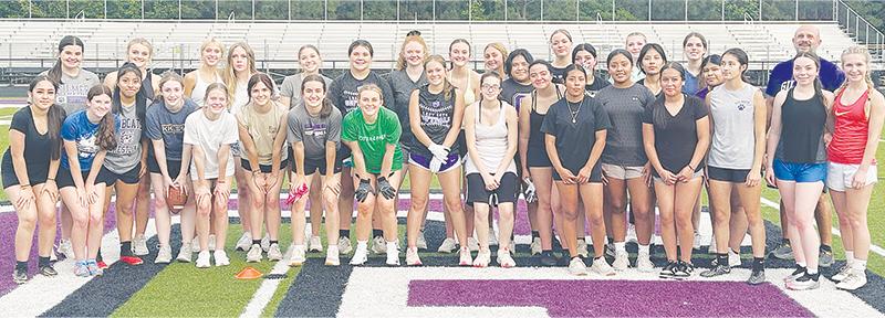 Joining head coach Chad Miller last week are players who tried out for Gilmer High’s flag football team. The season will begin in October.
