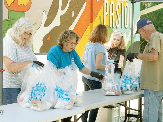 Members of Orchard Church volunteer at the Tower Road Mobile Home Park Monday, June 2.