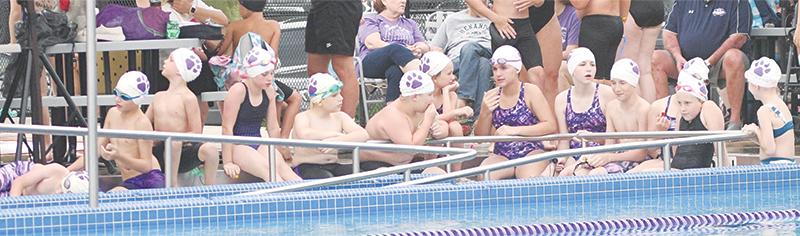 Gilmer swimmers take a break between events.