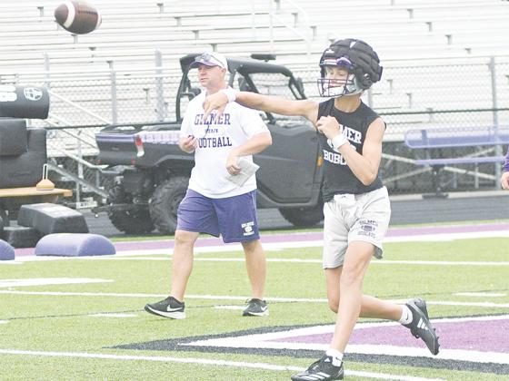 Rising GHS sophomore A.J. Callihan passes down field earlier in the summer. Callihan and senior Bo Cronic have taken the majority of varsity snaps at quarterback during the preseason.