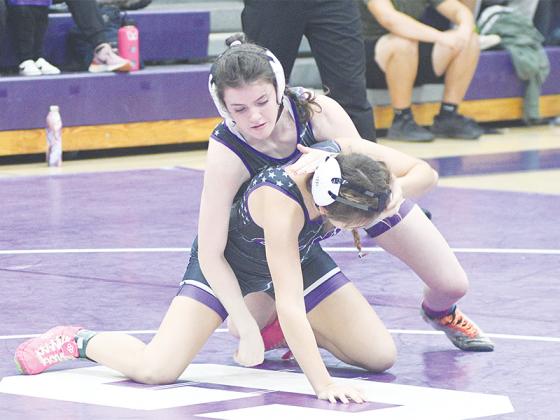 Gilmer’s Esther Bowman gains control of her opponent during last season’s Purple versus White Alumni Night.