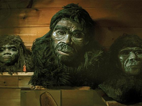 Bigfoot masks hang on a wall in a scene from “Unknown Ellijay.” (Photos contributed by Sozo Bear Films)