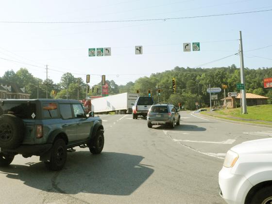 Cars navigate the junction where Industrial Boulevard, Highway 515, River Street and First Avenue meet.