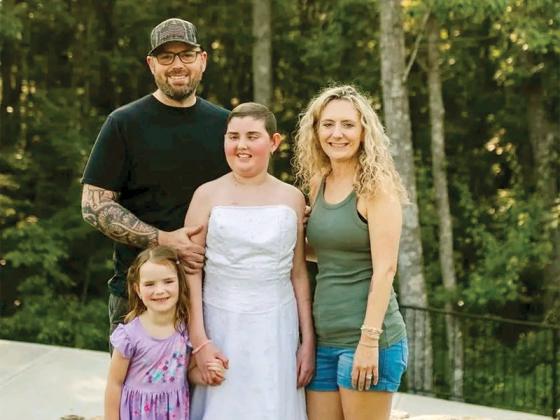 The Low family takes a photo together. From left, Sam Low, Brecklee Low, Saydee Low and Ashley Low.