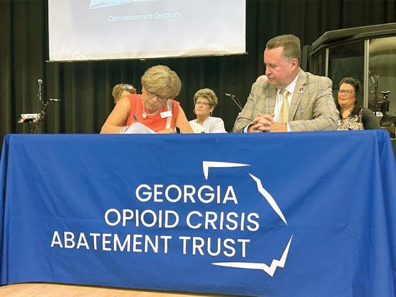 Judge Brenda Weaver and Department of Behavioral Health and Developmental Disabilities Commissioner Kevin Tanner celebrate the new funding grant for the Appalachian Judicial Circuit.
