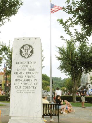 People gather by a monument to American soldiers on July 4.