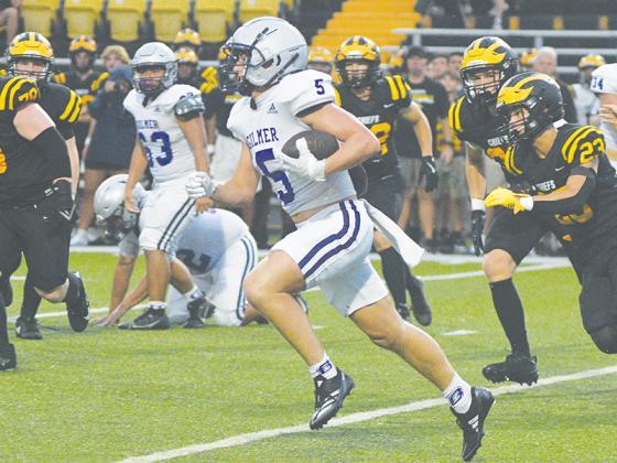 Gilmer High School senior Hunter Britain makes his way around the corner for a first down last Friday at Sequoyah.