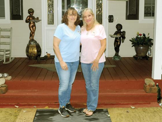 Volunteer and board member Dawn Lade, left, and Crystal’s Heart Healing House founder Noreen D’Onofrio, right, stand in front of Crystal’s Heart Healing House.