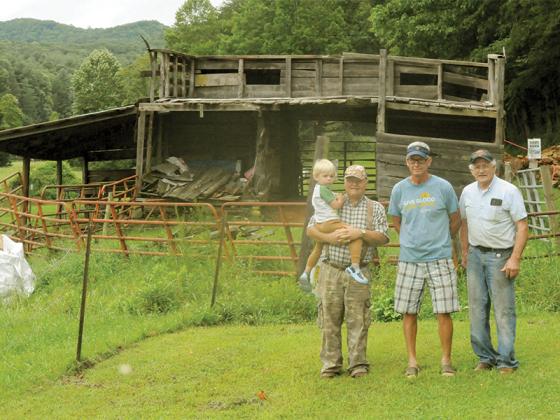From left, grandchild Bryan Roper, grandfather and neighbor Dwayne Davenport, barn repairers Mark Belongie and Ronnie Herendon.