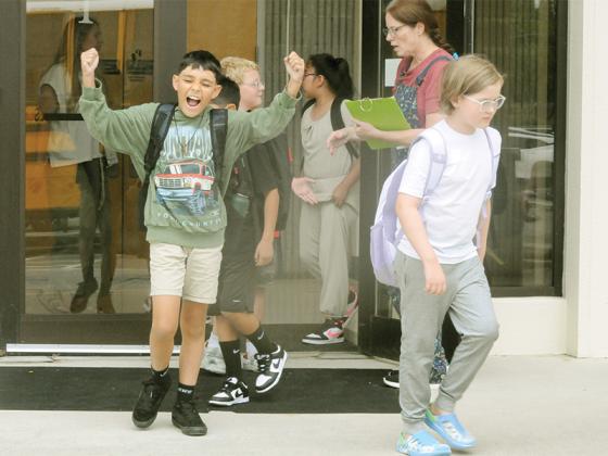 Kids celebrate after finishing their first Monday of school at Ellijay Elementary School. From left are Marcus Riddle, Kaiden Tucker, Stephanie Lopez Pacheco, Melissa Ball and Oliver Collins.