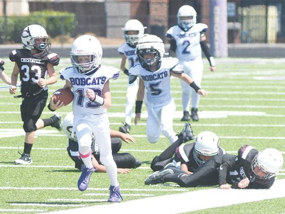 Jay Ponder tightropes the sideline during a punt return for a touchdown in the fourth grade’s 41-6 win.