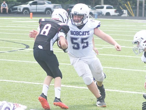 Sixth grader Jack Eller makes a tackle in the Bobcats’ 48-0 win versus Chesatee last Saturday. 