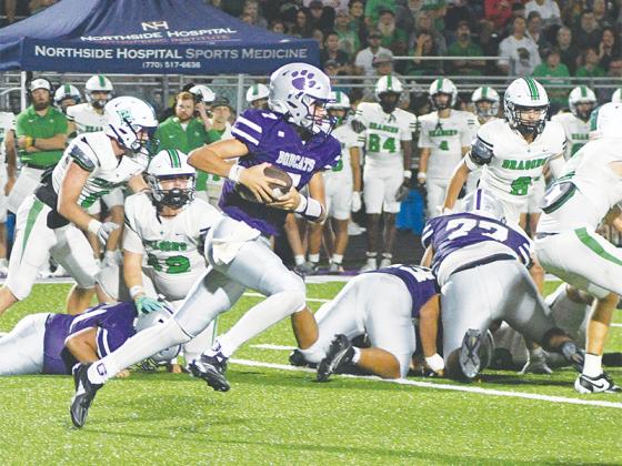 Gilmer sophomore quarterback A.J. Callihan cuts upfield last Friday versus Pickens. He rushed for 81 yards and threw for 53 more.
