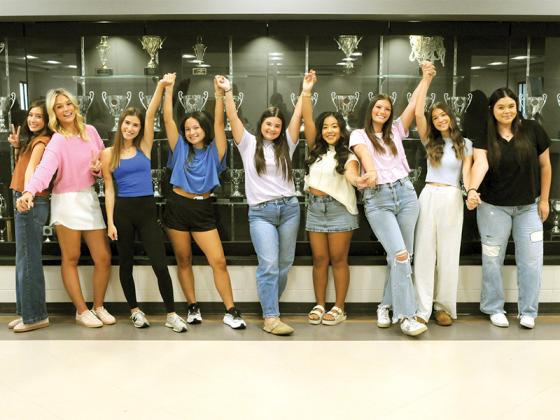 The Gilmer County High School homecoming court senior girls pose together for a playful picture. Shown are Jada Howard, Gracie Pritchett, Charley Heaslip, Natalia Barrios Aguillon, Gracie Gaitanoglou, Natalie Hernandez, Lyla Ard,  Lily Wingate and Marci Barrera. Bree Burnette is not pictured.