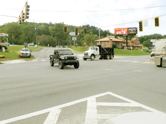 A work crew begins investigating the cause of a signal outage at the Highway 515 and First Avenue intersection.