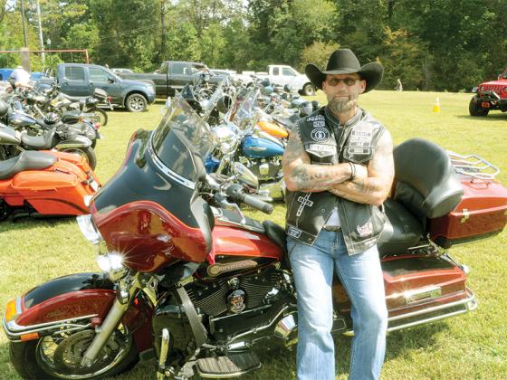 Broken Chains Point of Contact Ian Duncan stands beside his Harley Davidson motorcycle at the Appalachian Restoration Motorcycle Rally.