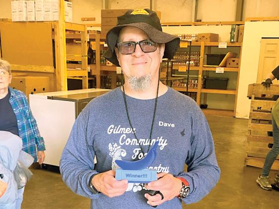 Gilmer County Food Pantry volunteer David Krier wins the Blue Banana Award for the first time May 14. (Photo by Allen Triebel/GCFP)