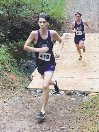 Gilmer High’s Seth Turner leads teammate Dawson Richard last Saturday in Forsyth County. (Contributed photo)