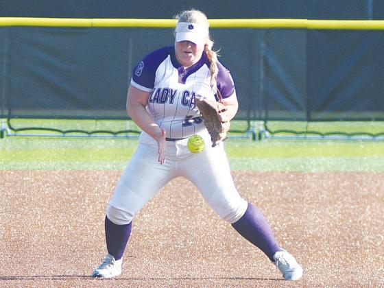 Gilmer High’s sure-handed shortstop Phoenix Addie fields a ground ball before recording an out at first base.