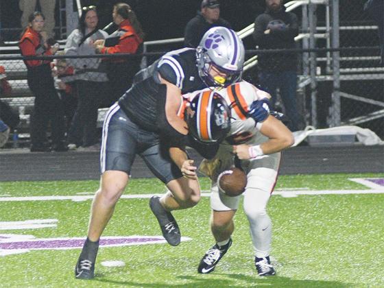 Douglas Callihan forces a fumble with his sack