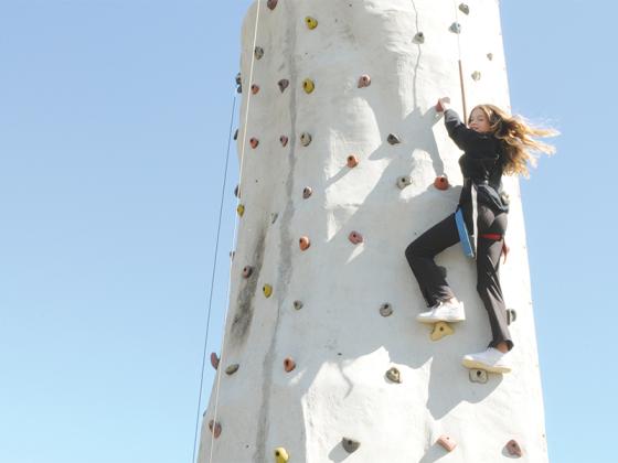 Peyton Reece scales the Georgia Apple Festival’s climbing wall on Saturday, Oct. 11. The festival will continue on the Oct. 18-19 weekend.