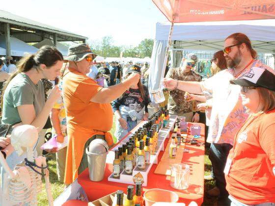 Attendees at the Georgia Apple Festival look at a hot sauce stand on Saturday, Oct. 11.