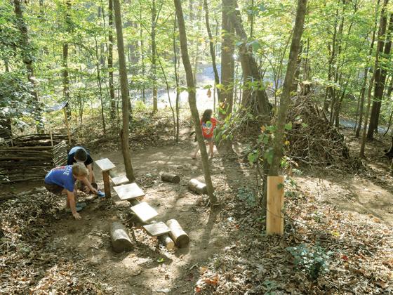 Kids play in their town of Mountainside Village. Shown from left are Haddon Lacey, Carter Bogue and Evi Lacey.