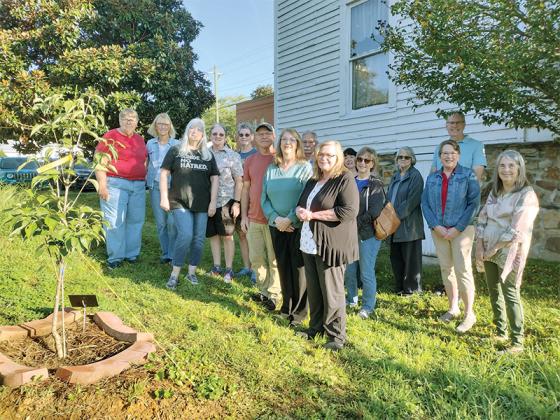 Friends of Gladys Dotson Spivey gathered Friday morning to dedicate a Stellar Pink Dogwood Tree in her memory at the Tabor House Museum. Spivey, active in the Gilmer County Genealogical Society, was 87 when she passed away in June. 