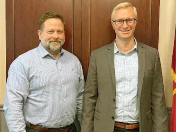Dustin Hamby, left, has been promoted to special agent in charge of the Region 1 Investigation Office located in Calhoun. Region 1 covers 12 counties in northwest Georgia. Also pictured is District Attorney Frank Wood of the Appalachian Judicial Circuit, who traveled to Cleveland for a recent going-away luncheon for Hamby at Region 8 headquarters. He will be sworn in during an upcoming promotion ceremony. (Contributed photo)
