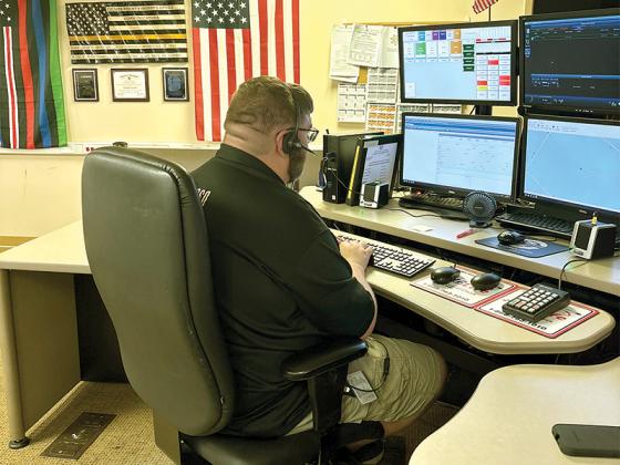 Communications Officer Derrick Conner answers a call at Gilmer County’s 911 Communications Division.