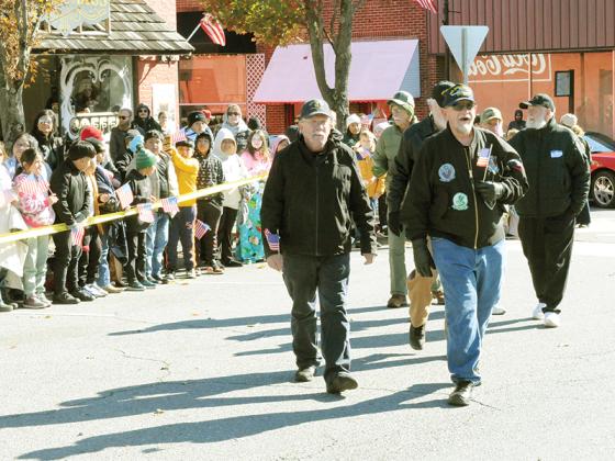 Veterans march through downtown Ellijay in the Community Veterans  Day Parade as local students honor them for their courage on Nov. 11.  The parade’s theme was “Peace Through Strength.”