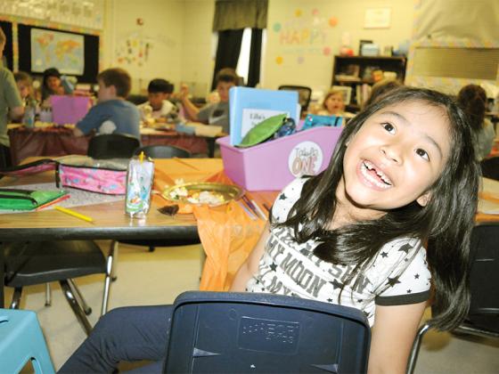 Ellijay Elementary School first-grader Griselda Alonzo Carmelo shows her missing teeth during a Charlie Brown Thanksgiving Feast Friday, Nov. 21. This Friday was the last day of school before Thanksgiving, and the first-graders were excited to celebrate the holiday.