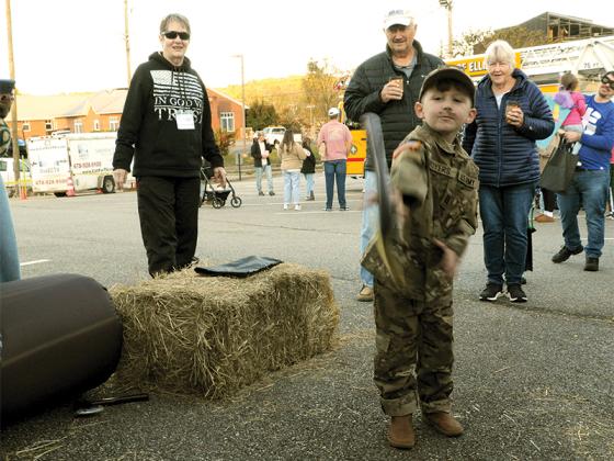 Myles Moyers, dressed as a soldier, throws an ax during the Ellijay First Baptist Church’s Fall Festival, Oct. 31.