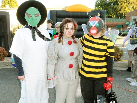 Teenagers show off amazing homemade costumes at the Ellijay First Baptist Church’s Fall Festival, Oct. 31. From left are shown Jennifer Bingham dressed as Lucy from Charlie Brown dressed as a witch, Nadya Jerome dressed as Pennywise and Ellica Ebarb as Strong Bad dressed as a bee.