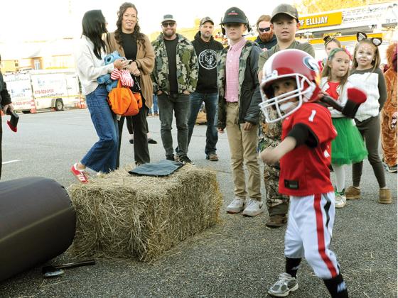 Chord Collins aims an ax at a target during the Ellijay First Baptist Church’s Fall Festival, Oct. 31.