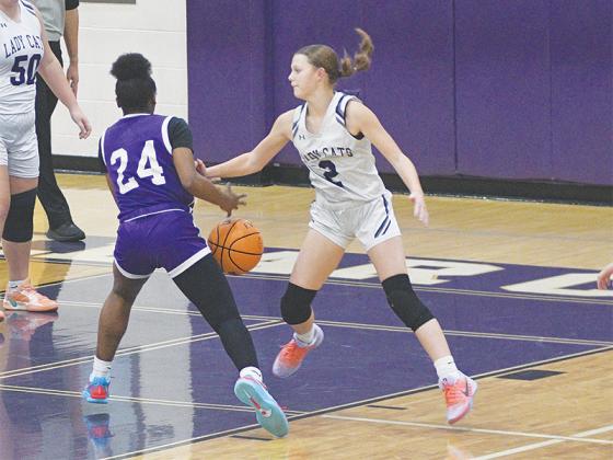 Kensie Farmer swats the ball loose to stop a drive.