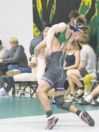 Gilmer senior Manny Velasquez scores a takedown versus Pickens last Saturday.